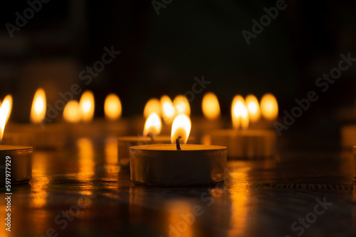 Bright yellow small candles in the evening