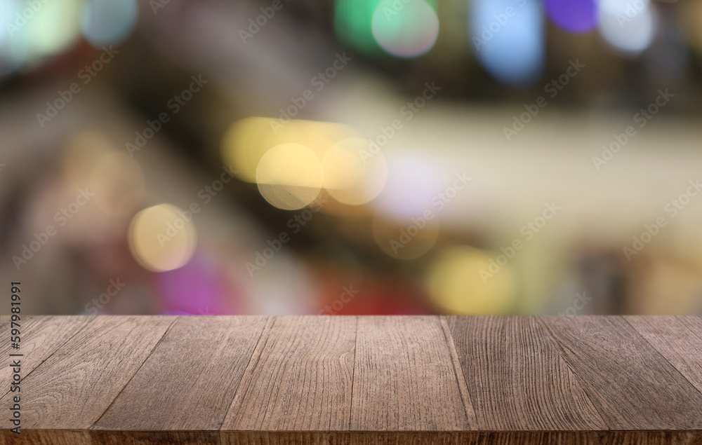 Empty wooden table in front of abstract blurred background of coffee shop . can be used for display or montage your products.Mock up for display of product