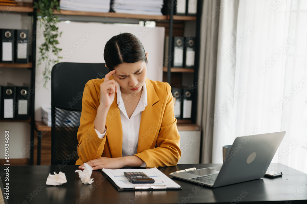 Business woman using tablet and laptop for doing math finance on an office desk, tax, report, accounting, statistics, and analytical research concept in office. Business woman using tablet and laptop for doing math finance on an office desk, tax, report, accounting, statistics, and analytical research concept in office.
