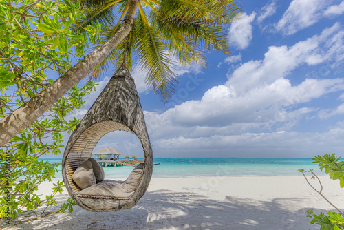 Tropical relax beach as summer island landscape with beach swing or hammock on palm, close to fantastic sea view. Amazing beach panorama vacation and summer holiday concept. Luxury panoramic travel 