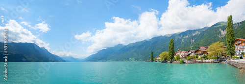 wide landscape panorama Brienzersee, historic village at the shore, tourist destination switzerland photo