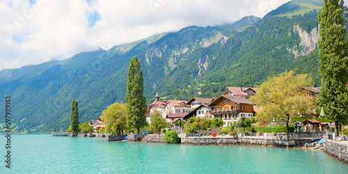Fototapeta Naklejka Na Ścianę i Meble -  pictorial lakeside Brienzersee, turquoise water, view to tourist resort Brienz, switzerland