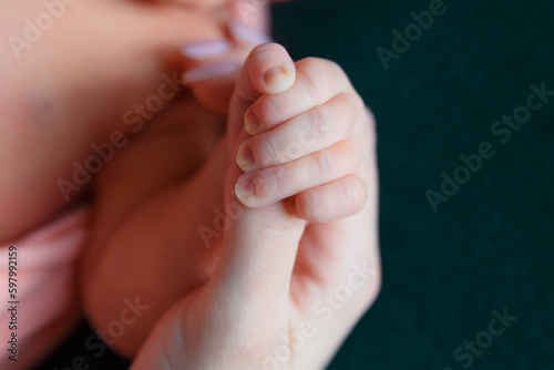 baby care, baby legs and arms, baby close-up