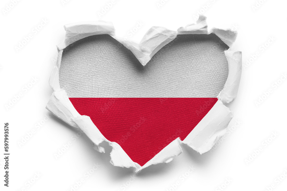 Heart shaped hole torn through paper, showing satin texture of flag of Poland, cut out