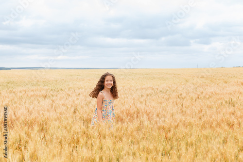 A young girl walking in a wheat field, girl in the field, wheat field, field of spikelets

A young girl walking in a wheat field, girl in the field, wheat field, field of spikelets



