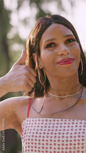 Happy trans woman raising the thumb up