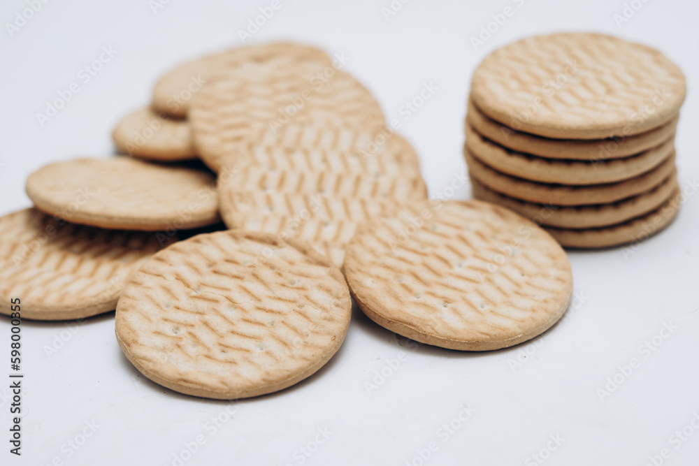 Cracker cookies lie on the table in a stack