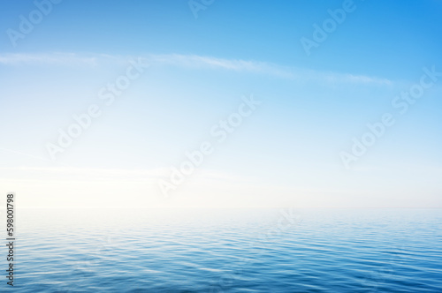 Blue sky over sea or ocean water surface © GIS