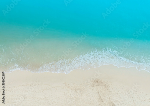 Aerial view with beach in wave of turquoise sea water shot, Top view of beautiful white sand background © SASITHORN