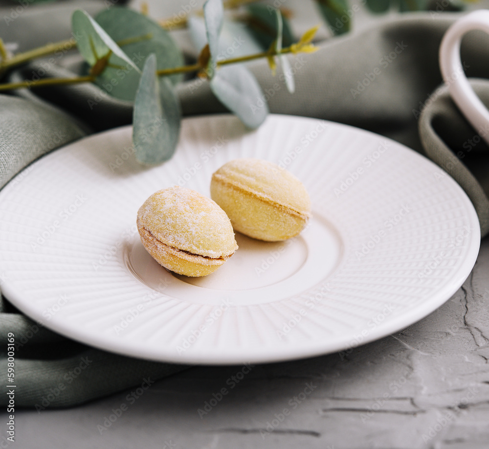 Cup of coffee and cookies in the shape of walnuts Cup of coffee and cookies in the shape of walnuts