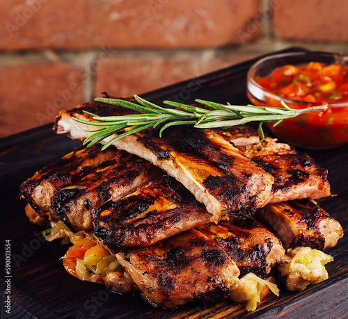 Bbq pork ribs grilled with tomatoes herbs