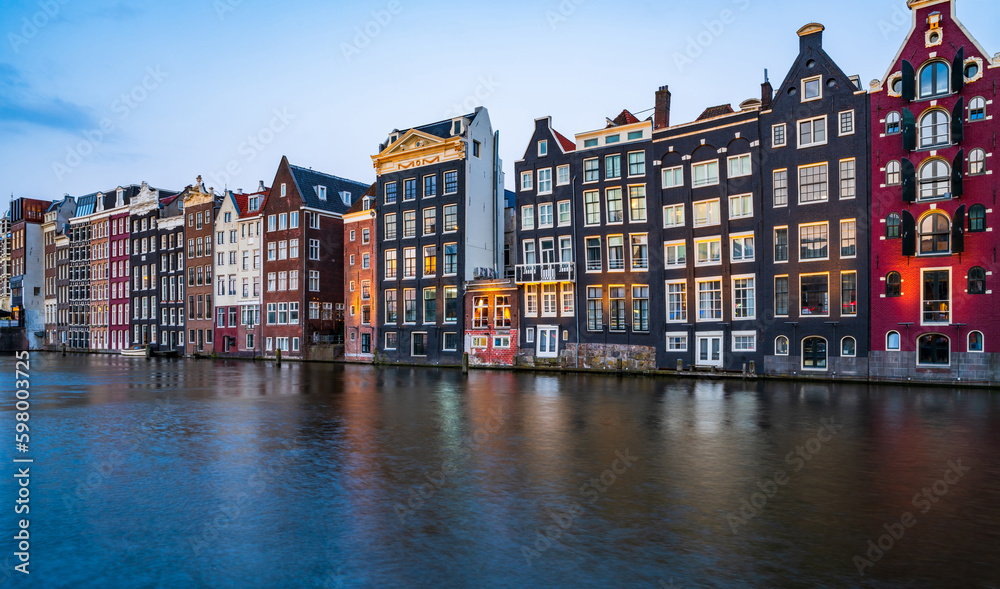Typical Dutch houses in Amsterdam by the canal. Holland