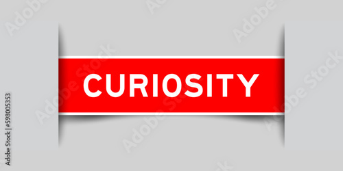 Red color square label sticker with word curiosity that inserted in gray background
