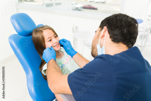 Adorable little kid with a big smile at the pediatric dentist