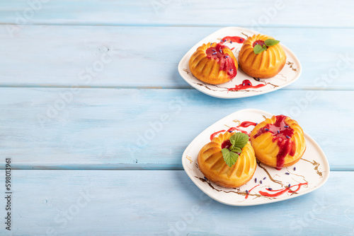 Semolina cheesecake with strawberry jam, side view, copy space.