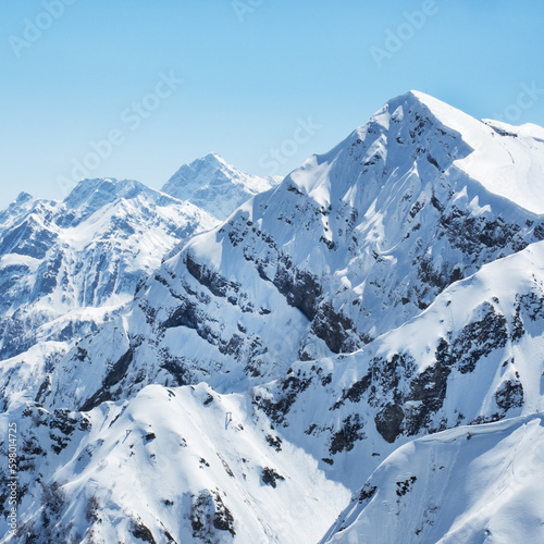 Beautiful snowy peaks of the Caucasus Mountains. Krasnaya Polyana Rosa Khutor Ski Resort, Russia.