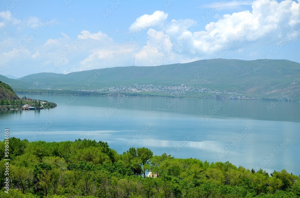 beautiful shore of Lake Sevan with clouds and mountain range, Armenia
