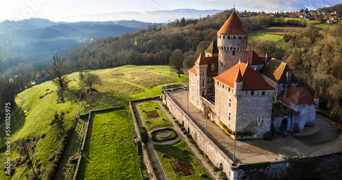 Aerial drone panoramic view of beauiful medieval castle Chateau de Montrottier, Rhone-Alpes, Savoie, France photo