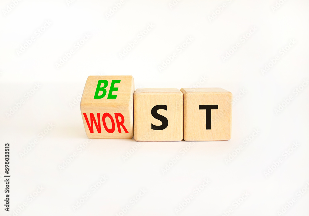 Best or worst symbol. Businessman turns wooden cubes and changes the word best to worst. Beautiful white table white background, copy space. Business and best or worst concept. Best or worst symbol. Businessman turns wooden cubes and changes the word best to worst. Beautiful white table white background, copy space. Business and best or worst concept.