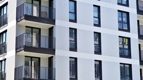 Modern apartment buildings on a sunny day with a blue sky. Facade of a modern apartment building. Contemporary residential building exterior in the daylight. 