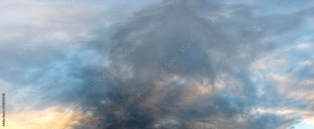 Obraz premium Russia. South of Western Siberia. Gloomy sunset clouds in the evening summer sky over the mountain ranges of Altai.