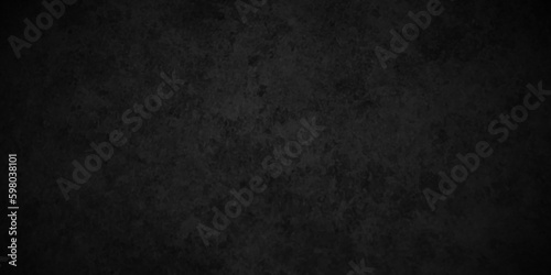 Dark black Close up retro plain dark black cement and concrete wall background texture. Background image of texture plaster on the wall in dark black tones in grunge style backdrop.