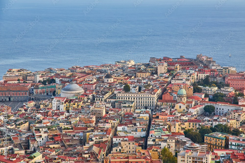Naples, Italy evening panorama of city center coastal section with Plebiscito square and Palazzo Real