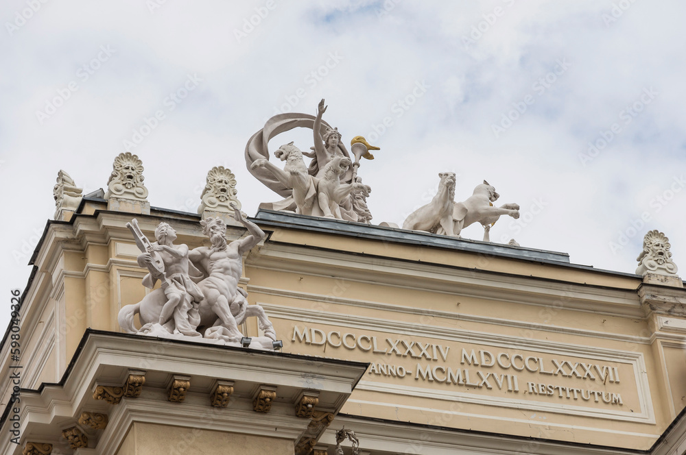 Obraz premium The facade of the Odessa Opera House, sculptural compositions on the facade of the theater with Roman numerals - the date of construction of the theater