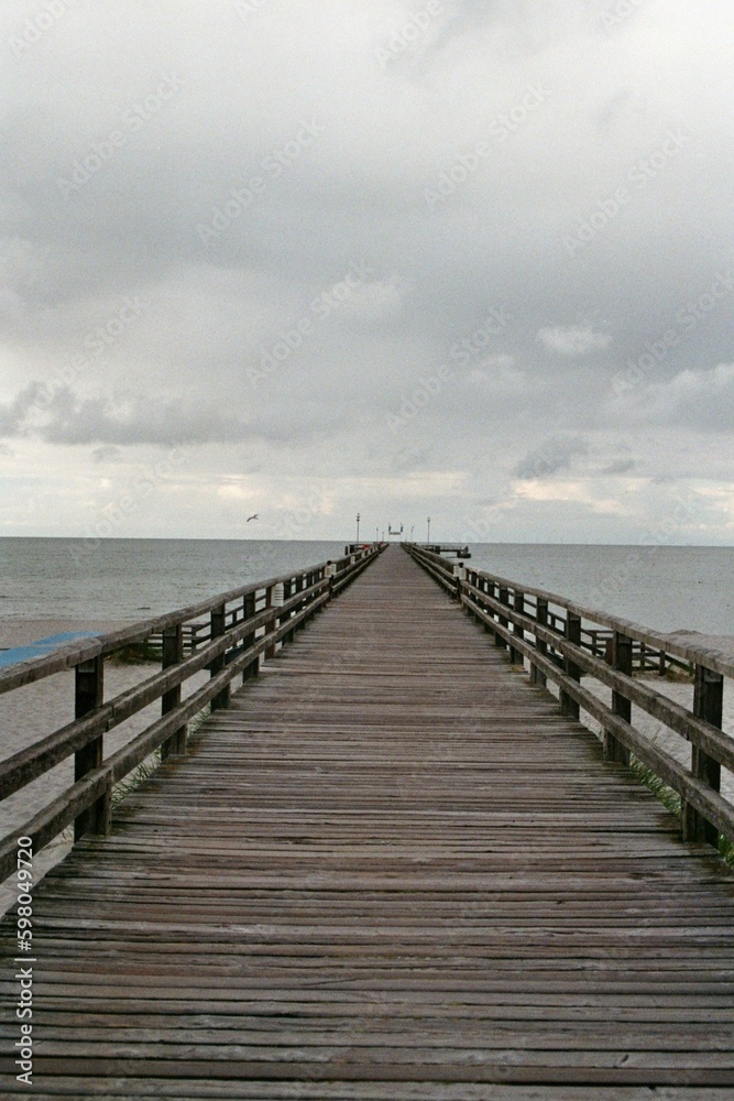 wooden pier on the sea - analog film 
