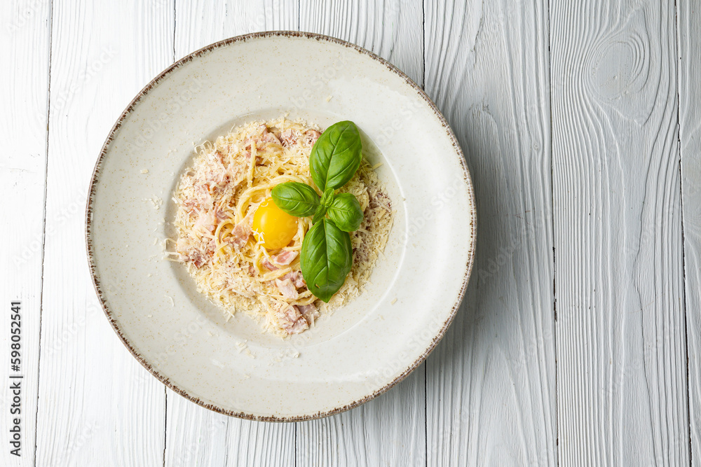 delicious pasta in a plate on a white wooden table. close-up
delicious pasta in a plate on a white wooden table. close-up