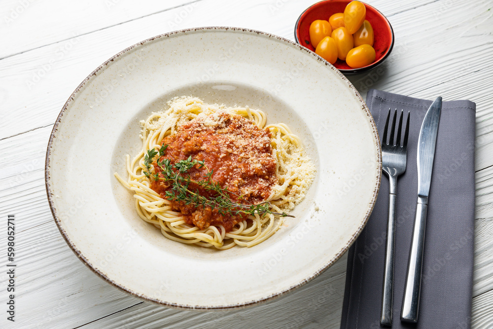 delicious pasta in a plate on a white wooden table. close-up
delicious pasta in a plate on a white wooden table. close-up