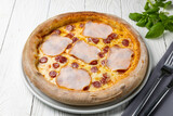 delicious pizza on a white wooden table. close-up
