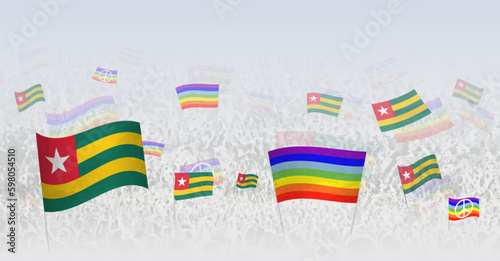 People waving Peace flags and flags of Togo. Illustration of throng celebrating or protesting with flag of Togo and the peace flag.