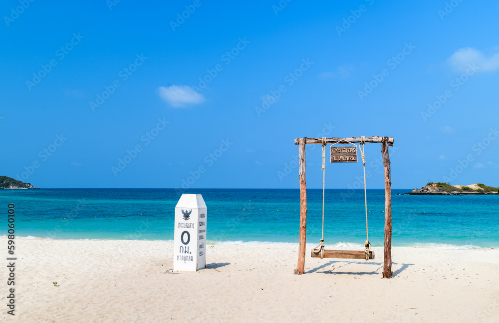 milestone and swing on beach with sea at Luklom beach, Samae San island, milestone and swing on beach with sea at Luklom beach, Samae San island,