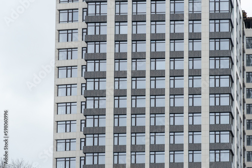 Geometry modern of apartment building exterior. Architectural details of luxury house and home complex. Fragment contemporary residential condominium. New multistorey skyscrapers in business district.