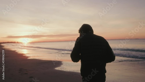 training of a boxer by the beach at sunrise photo