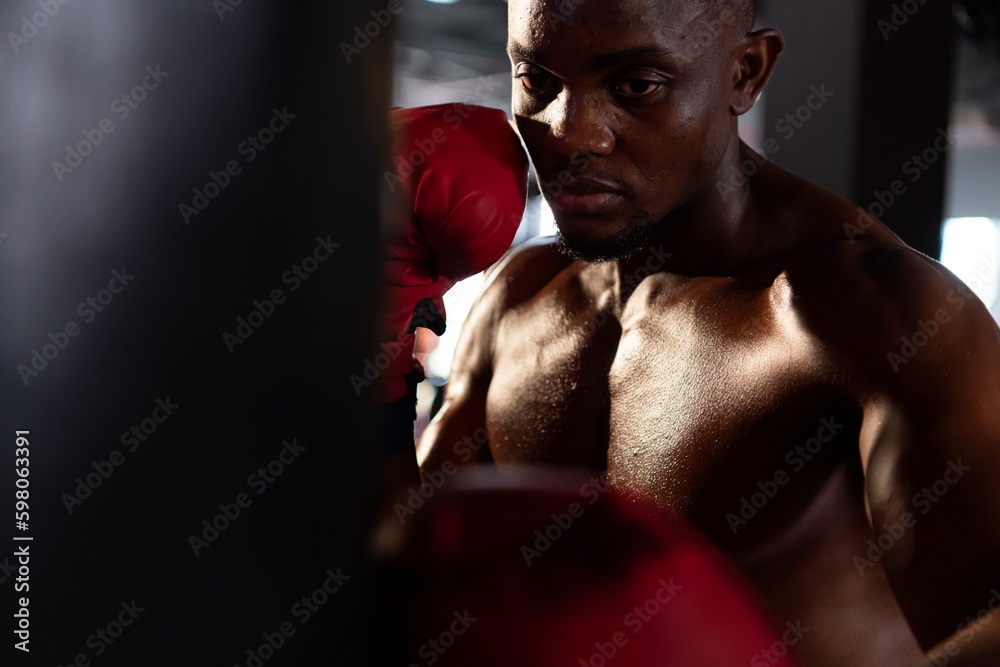 Portrait of boxers must practice their kicking and punching skills with punching bag. To build strength and power of kicking and punching.