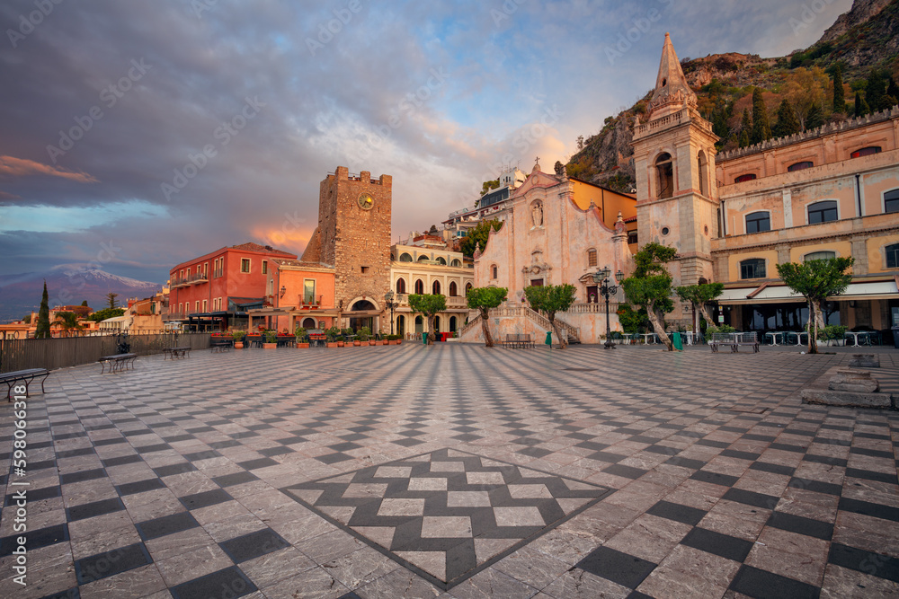 Taormina, Sicily, Italy. Cityscape image of picturesque town of Taormina, Sicily with main square Piazza IX Aprile and San Giuseppe church at sunrise.