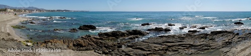 Rocks on sea shore in Cala de Mijas, Spain - panorama © PX Media