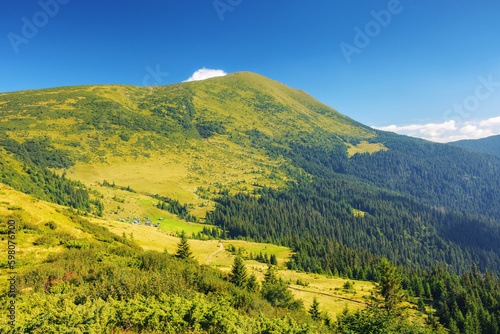 green mountain landscape. view in to the distant ridge. warm summer forenoon