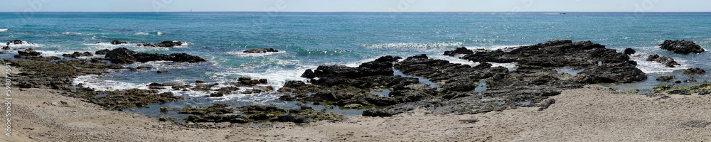 Rocks on sea shore in Cala de Mijas, Spain - panorama