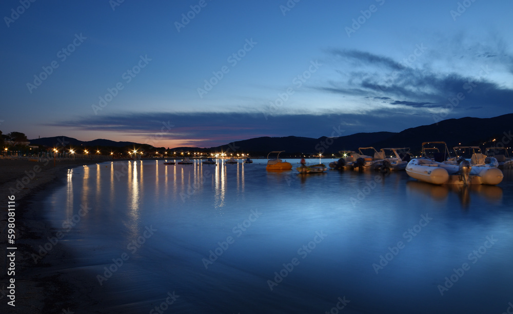 Incredible blue light crosses the sea creating a magical atmosphere