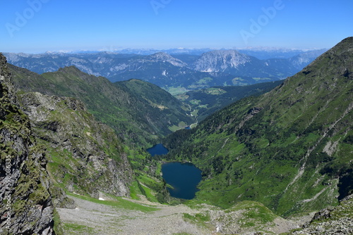 Blick von der Neualmscharte auf Obersee, Hüttensee, Steirischen Bodensee und Ennstal, Stoderzinken, Kammspitz und Totes Gebirge, Schladminger Tauern, Steiermark photo