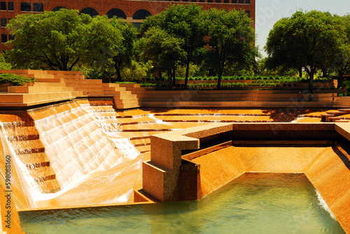 The Water Garden in Downtown Ft Worth Texas offers a cascading man made waterfalls over stone levels in a town plaza photo