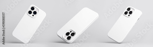 set of three iPhone 14 and 13 Pro Max in white silicone case falling down in different angles, back view isolated on grey background, phone case mockup