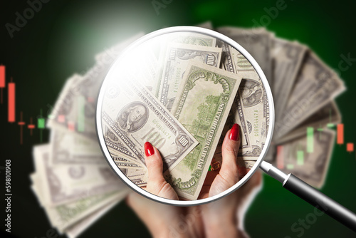 Money dollars. Magnifying g...
