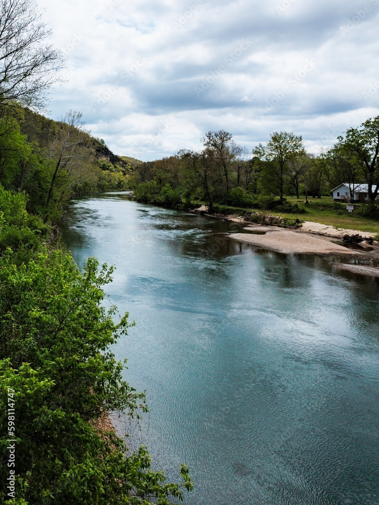 Big Piney River as seen from the bridge near Devil's Elbow, MO, a community on historic old Route 66. The community was named for a bend in the river that frequently caused log jams. Big Piney River as seen from the bridge near Devil's Elbow, MO, a community on historic old Route 66. The community was named for a bend in the river that frequently caused log jams.