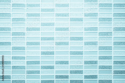 Blue ceramic wall and floor tiles abstract background. Design geometric mosaic texture for the decoration of the bathroom.