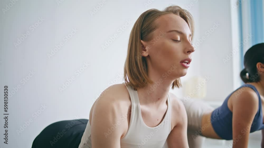 Sport couple practicing yoga at home. Flexible athletes cat cow pose stretching Generative AI Sport couple practicing yoga at home. Flexible athletes cat cow pose stretching Generative AI