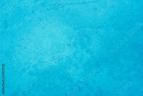 Blue concrete stone texture for background in summer wallpaper. Cement and sand wall of tone vintage. Concrete abstract wall of light cyan color. 